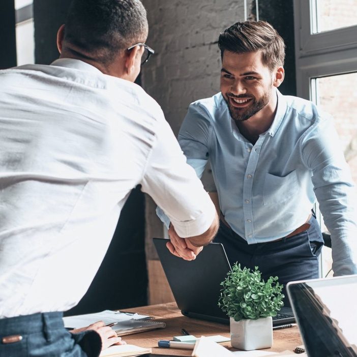 ORB consultants shaking hands with a business partner